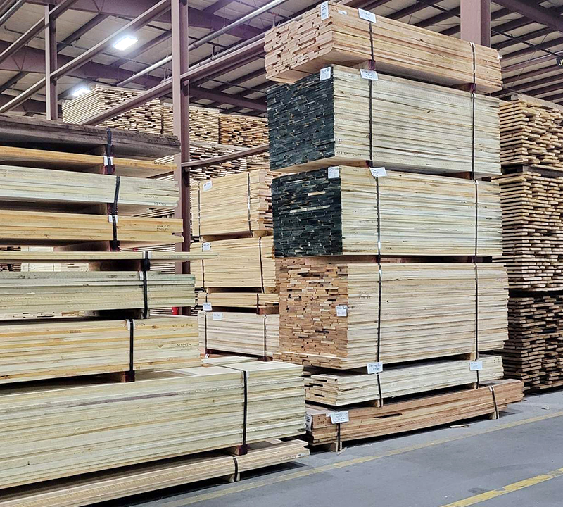 stacks of finished lumber labeled and ready for shipment
